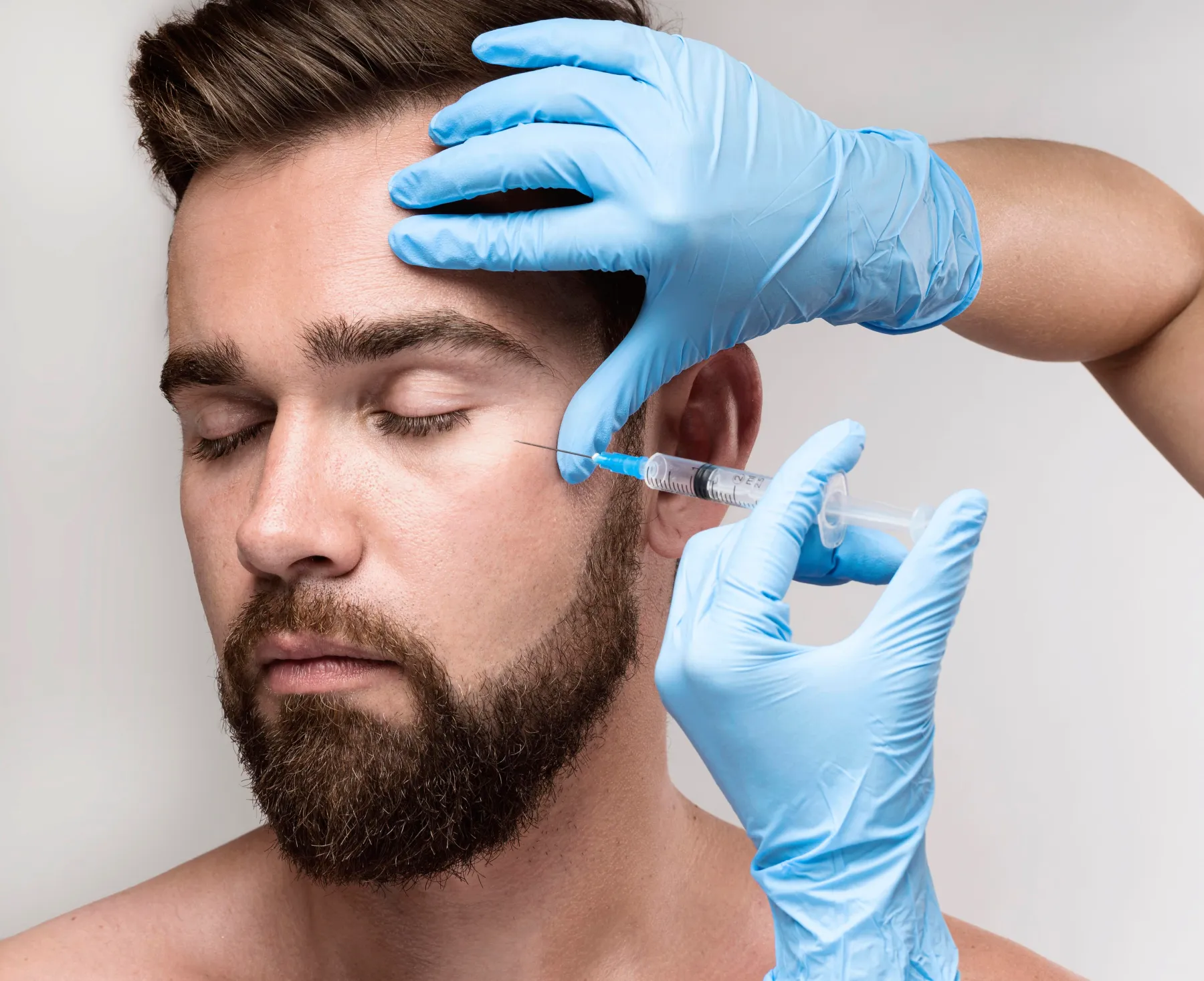 portrait-man-being-injected-his-face | The Lift Bar Med Spa Near Me Nicholasville | Rejuvenation, Wellness & Beauty